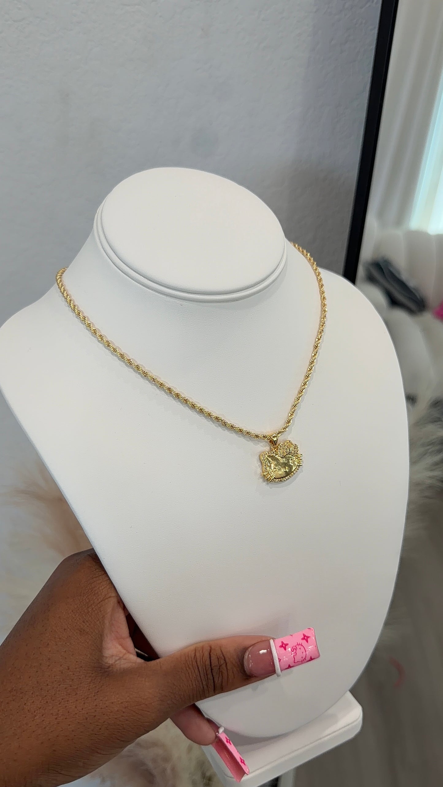 Gold HK face necklace