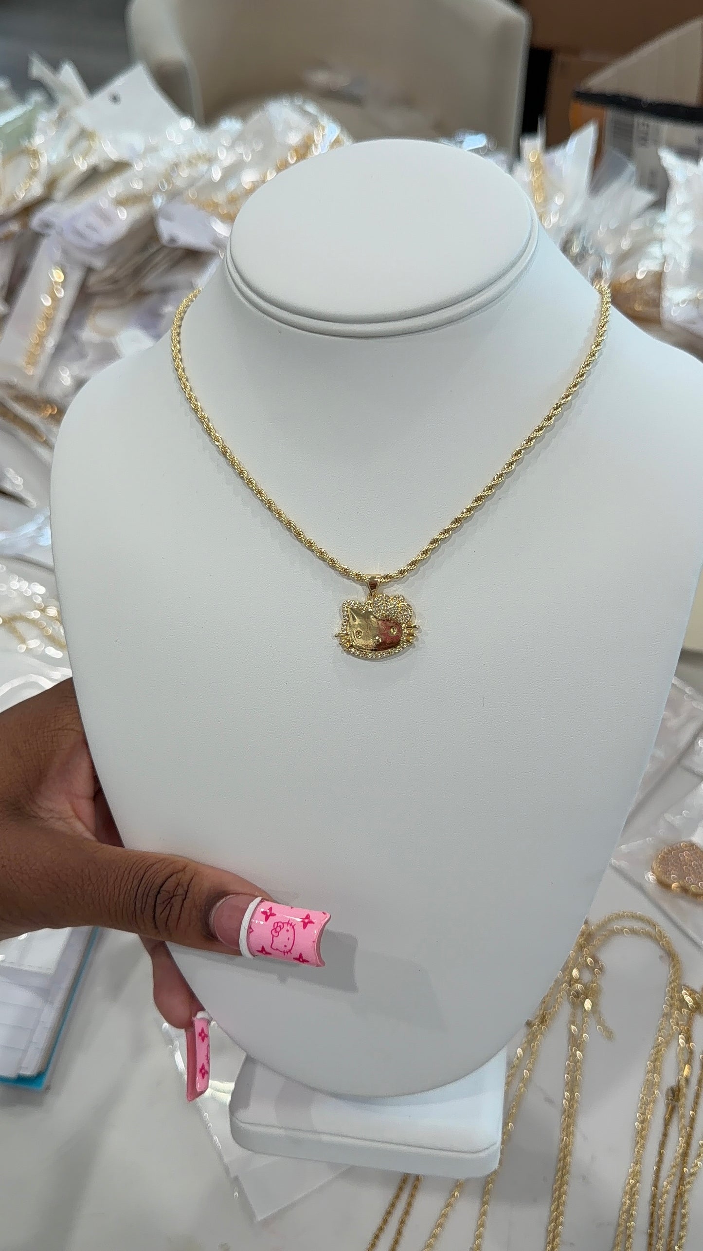 Gold HK face necklace