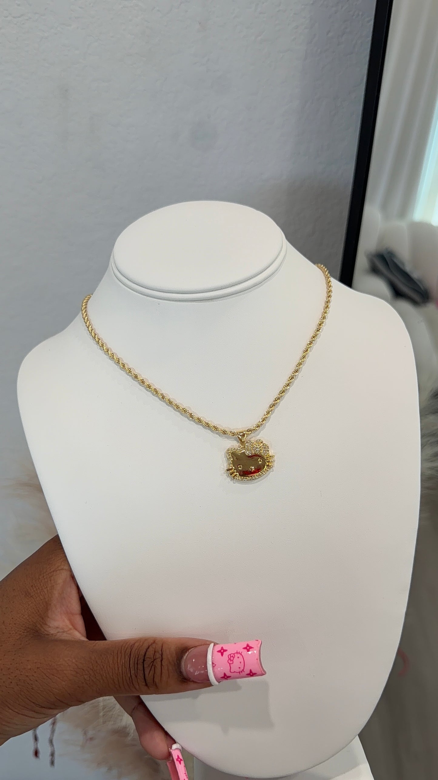 Gold HK face necklace